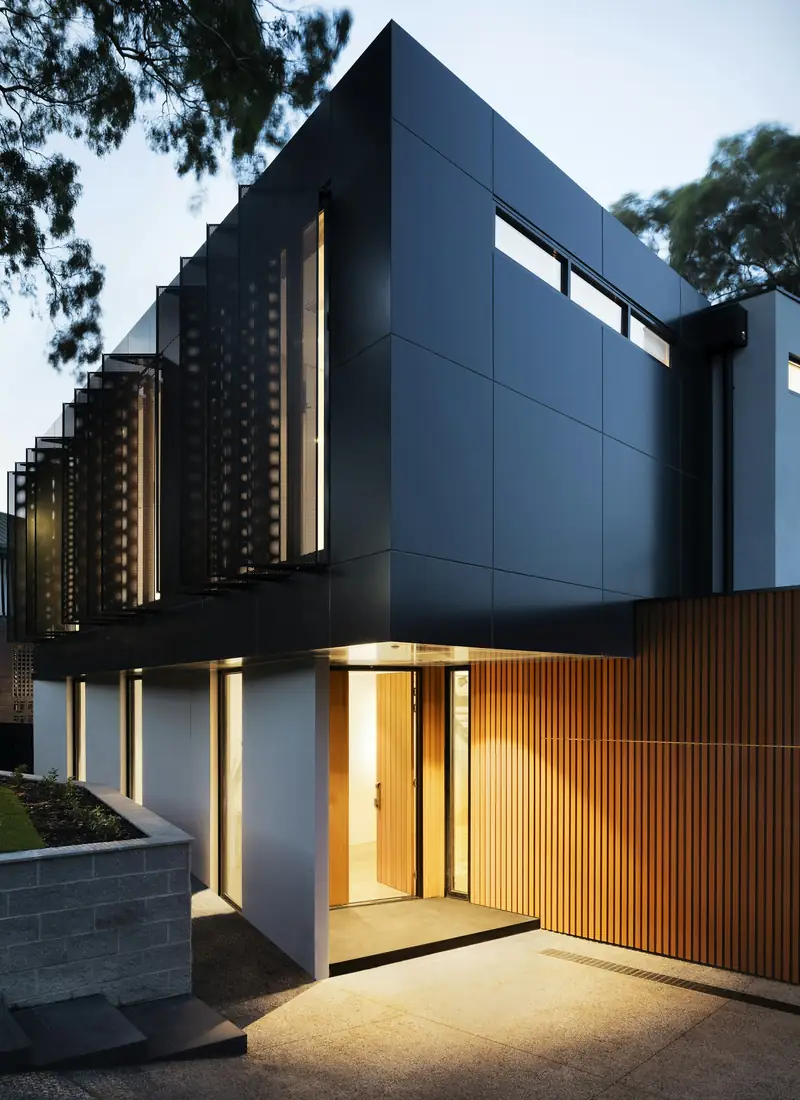 Modern home lit at dusk