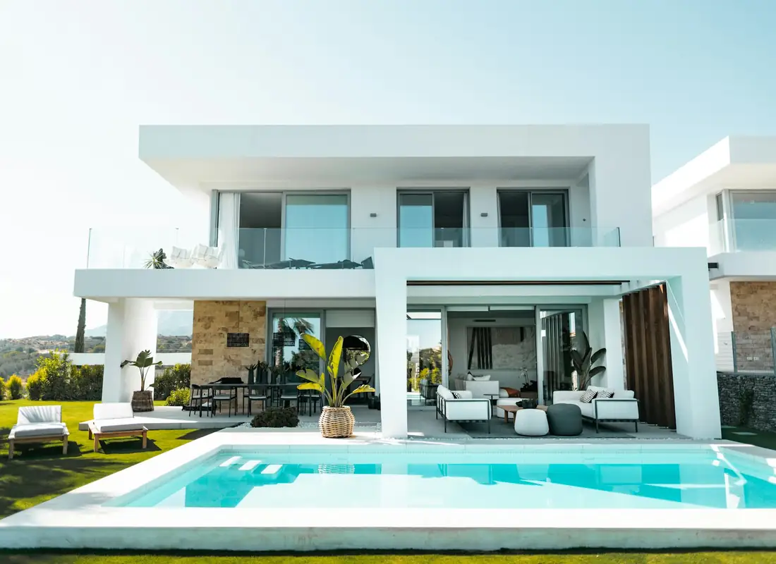 White modern exterior with a pool