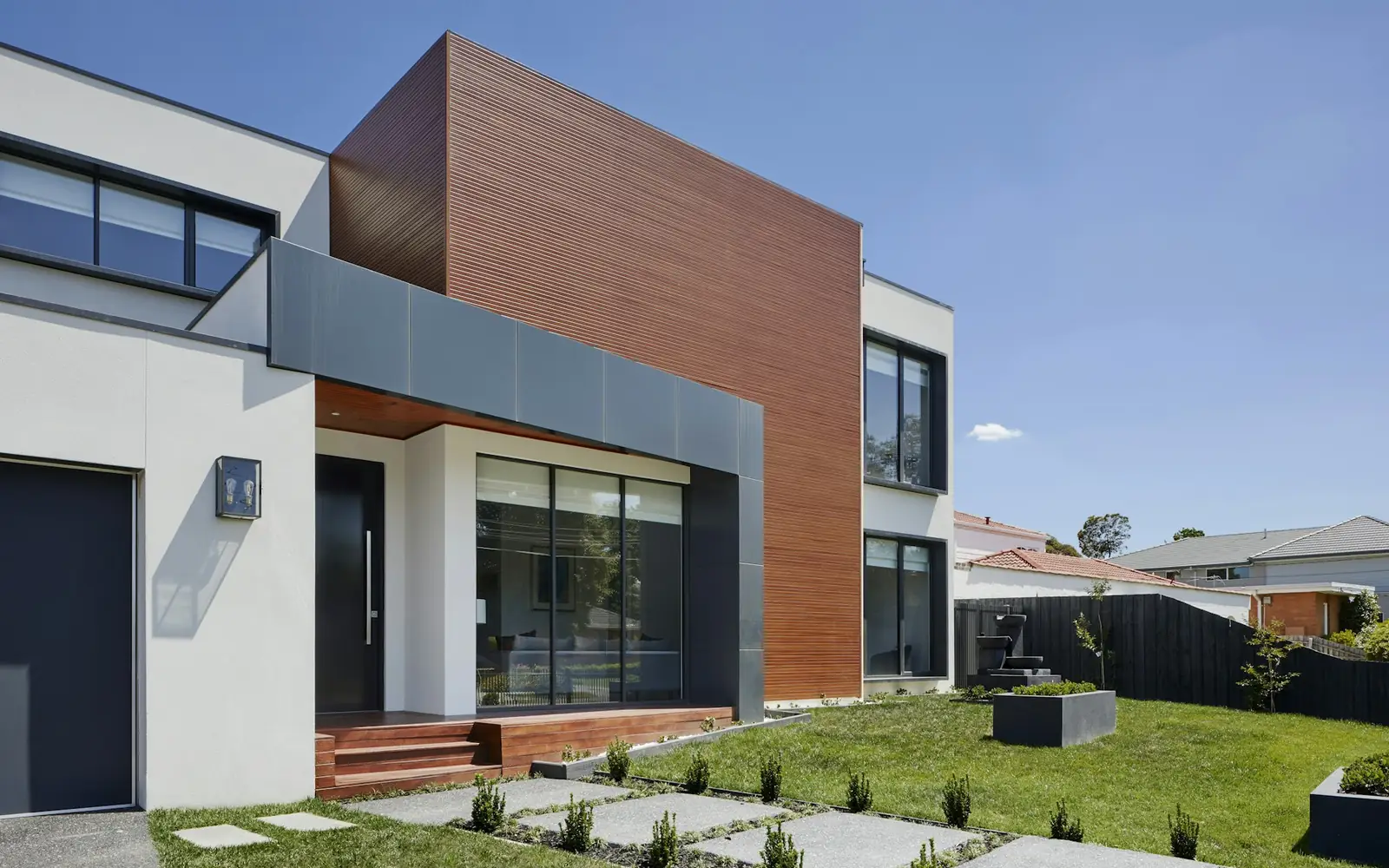Modern two-story home with a landscaped front yard